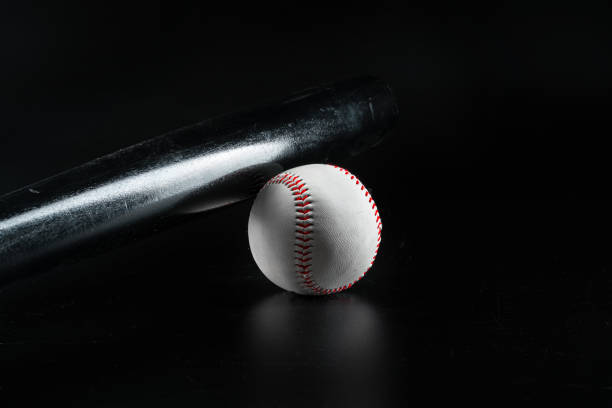 istock Baseball game equipment on dark black background 1472554627