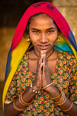 istock Namaste! Portrait of Indian girl in desert village, India 1472555496