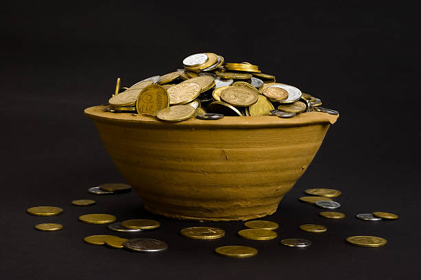 istock coins in the pot and near 147255555