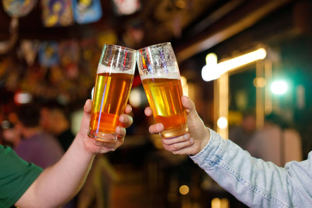 istock Two men drinking beer at the bar. They celebrate St. Patrick's Day. They are having fun 1472555986