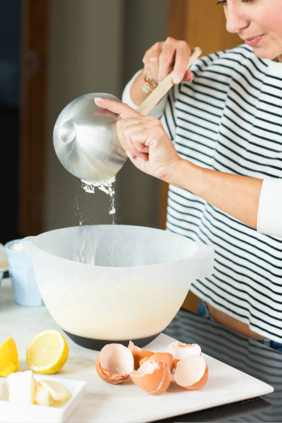 istock Woman hands kneading the dough while cooking apple pie 1472556568