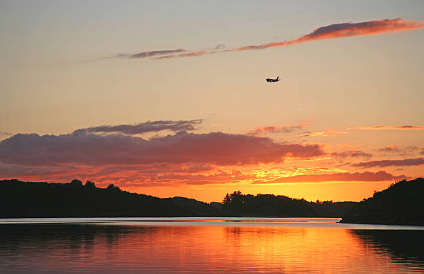 istock Airplane landing in sunset 147255697