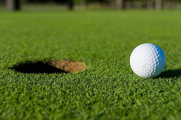 istock Golf Ball Near Hole 147255786