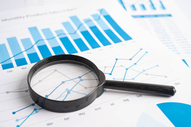 istock Magnifying glass on graph paper. Financial development, Banking Account, Statistics, Investment Analytic research data economy, Business concept. 1472558053