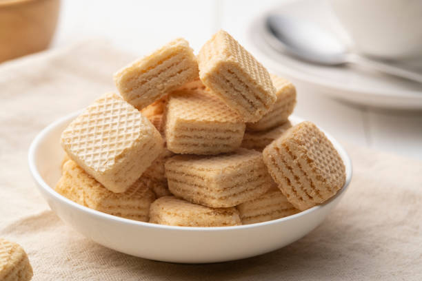 istock Wafer filled with milk cream flavored in white plate 1472558312