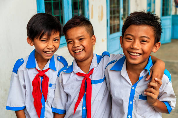 Group of Vietnamese schoolboys, South Vietnam Group of happy Vietnamese schoolboys, South Vietnam vietnamese culture stock pictures, royalty-free photos & images