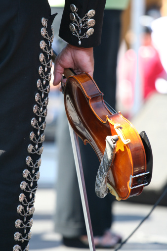 Violinist wearing traditional mexican suit