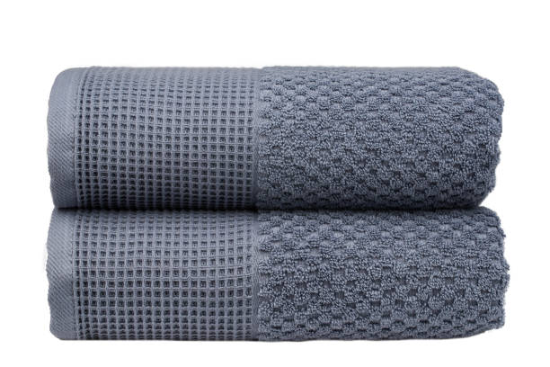 istock multicolored terry towels, rolled up and stacked on the table 1472562616