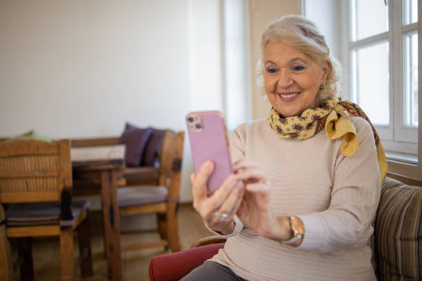 istock Happy senior woman using phone 1472562768