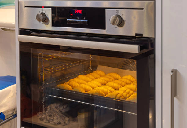 istock Baking Croissants in Oven 1472564364