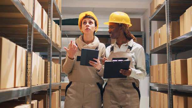istock Depot workers examining products stock on files 1472564994
