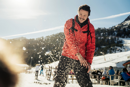 one man skiing, white snowy background, deep powder snow