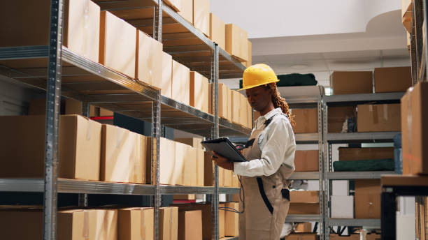 istock Warehouse employee working with scanner and tablet 1472566124