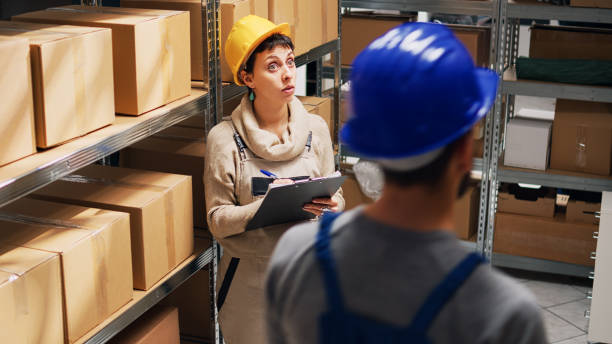 istock Storehouse employee analyzing cargo packages in depot 1472566468