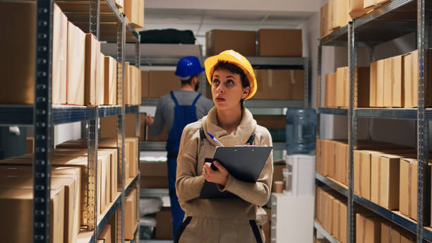 istock Depot supervisor checking list of merchandise on files 1472566525