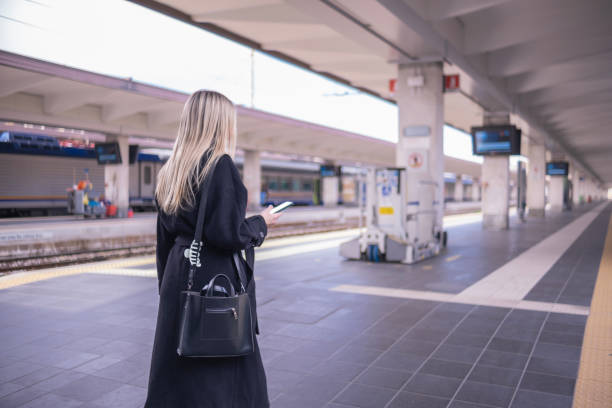 istock Checking on which platform departs the local train for University 1472566925