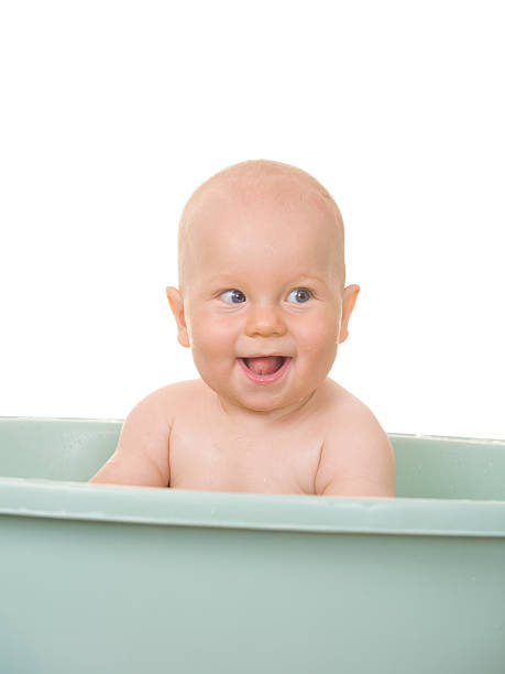 Baby bathing stock photo