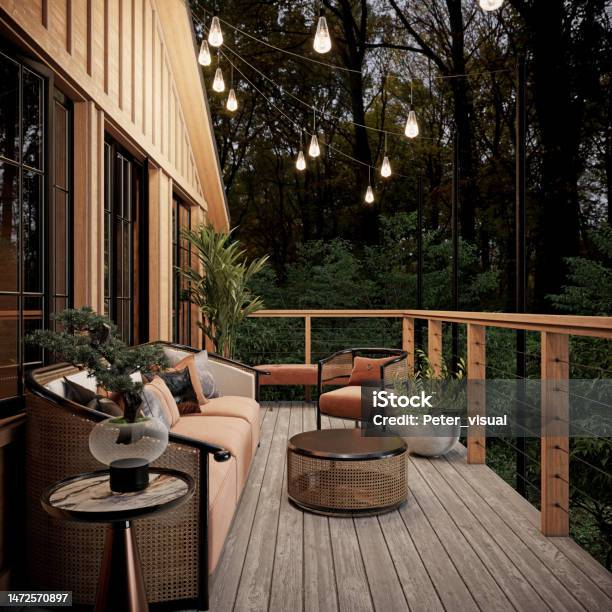 Balcony Terrace In A Wooden House With Upholstered Furniture And Beautiful Green Surroundings Stock Photo - Download Image Now