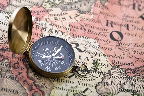 istock Beautiful golden compass on an old map 147257240