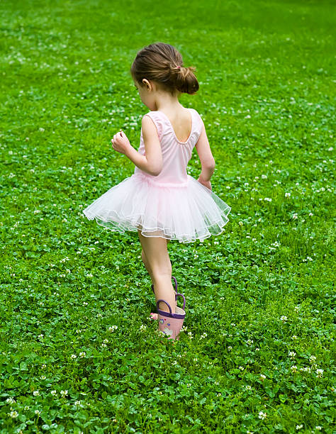 Little Girl in Clover Field stock photo