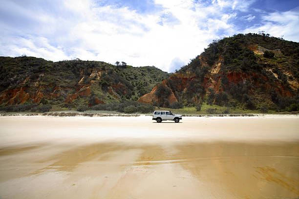 4WD Fraser Island 4WD passing Red Rock along 75 mile beach on Fraser Island/file_thumbview/7607447/1 sunshine coast australia stock pictures, royalty-free photos & images