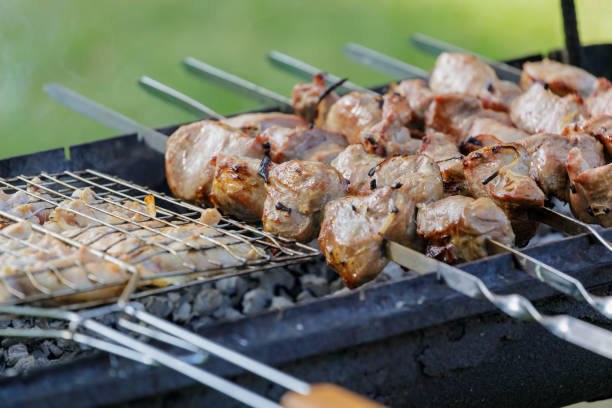 istock Meat on skewers, grilled. Close-up. 1472573795