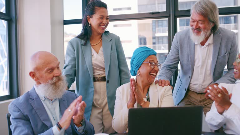 Laptop, winning and business people clapping in office success, congratulations or celebration of company target. Winner, news and applause of team manager or muslim woman email and technology update