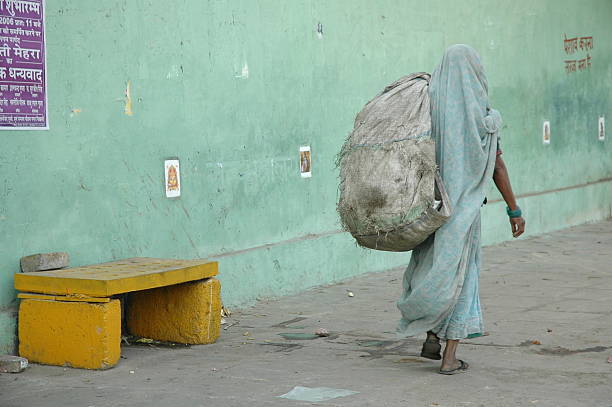 An Indian street woman collects \