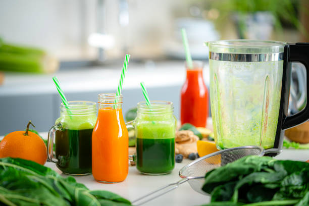istock Detox fruits and vegetables juices on kitchen table 1472582564