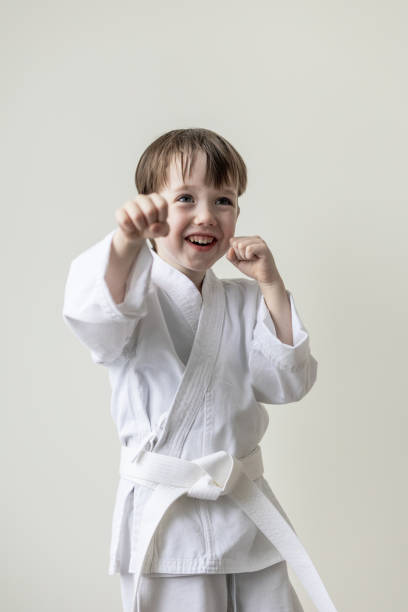 istock 5 year old white boy, martial arts student in kimono 1472584715