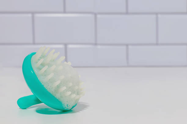 istock Scalp cleansing brush with foam in the bathroom 1472585036