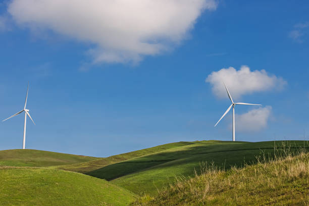 istock Wind power mill on the green hills 1472585092