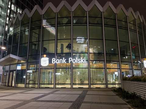 Warsaw, Poland - March 03, 2023: Branch of PKO Bank Polski at night.