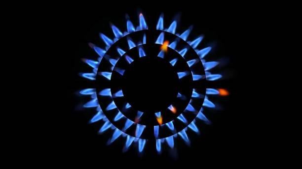 3d rendering of a kitchen burner glowing at night, close up - blue flame natural gas fireplace imagens e fotografias de stock