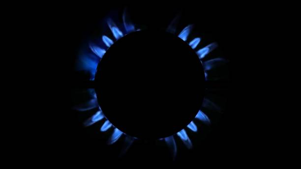 istock 3D rendering of a kitchen burner glowing at night, close up 1472591505