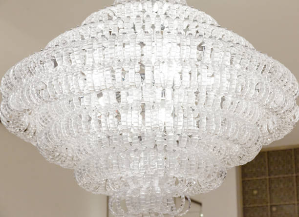 istock A beautiful white large crystal chandelier hangs on the ceiling in a bright room. 1472596863