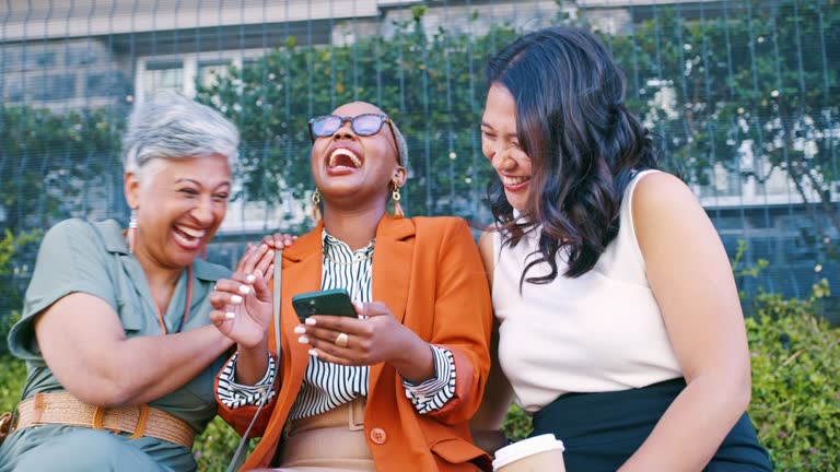Happy, laughing or business women with phone on park bench on lunch for reading blog, social media or news. Funny, smile or employee on smartphone for networking, fun or comic internet meme. content