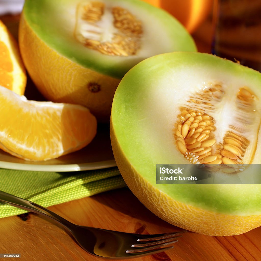 Melon and Oranges fresh melon and oranges on plate Citrus Fruit Stock Photo