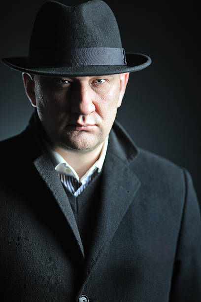 istock Man with a hat isolated on black background 147260338