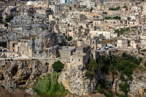 Matera, Italy - September 19, 2019: Panoramic view of Sassi di Matera a historic district in the city of Matera, well-known for their ancient cave dwellings from the Belvedere di Murgia Timone,  Basilicata, Italy