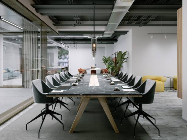 istock Office space with a large table for conferences and negotiations with clients. 1472604255