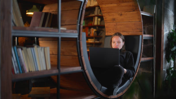 istock Woman using laptop in cafe 1472604977
