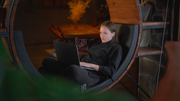 istock Woman using laptop in cafe 1472605020