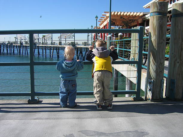 Kids at the pier stock photo