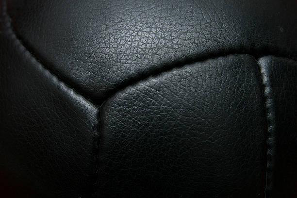 Close up black vintage football with seam