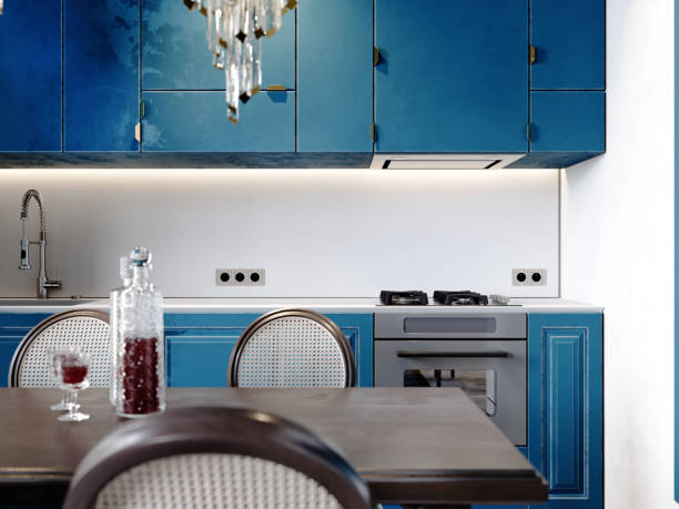istock Modern classic kitchen with black dining table and chairs and light blue kitchen furniture and white walls. 1472607376