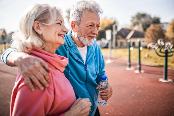 istock Senior couple taking a break from exercising 1472610828