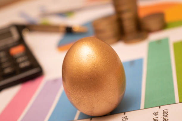 istock Golden egg on office table, future investment concept 1472611938
