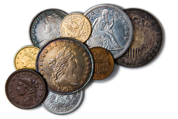 Coins from Savings – Horizontal Close-up image of coins with a shallow depth of field.  Coins that were pulled out of savings account or inheritance because of economic hardship.  Variance of silver, cold, copper currency from different countries. european union coin photos stock pictures, royalty-free photos & images