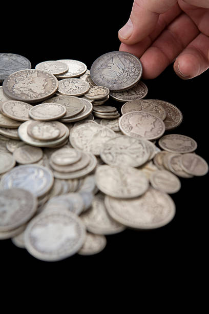 istock Hand Reaching for Coins from Savings – Vertical 147261464